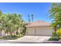 Charming single-story home with a three-car garage, mature trees and well-manicured landscaping at 1869 Desert Forest Way, Henderson, NV 89012