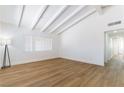Bright living room featuring high vaulted ceilings, wood flooring and white walls at 1916 Howard Ave, Las Vegas, NV 89104