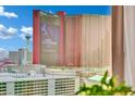 View of Resorts World Hotel from condo window with pools and palm trees at 2000 N Fashion Show Dr # 2222, Las Vegas, NV 89109