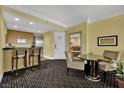 Open floor plan with bar-style kitchen and dining space in living area at 2000 N Fashion Show Dr # 2222, Las Vegas, NV 89109