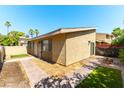 Private backyard with brick pavers and lush green grass, offering a serene outdoor retreat at 2241 Tall Pine Dr, Las Vegas, NV 89108