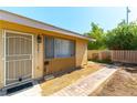 Inviting front entrance with decorative door, stylish exterior lighting, and brick walkway at 2241 Tall Pine Dr, Las Vegas, NV 89108
