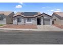 Charming single-story home featuring desert landscaping and solar panels for energy efficiency at 2832 Sing Song Way, Las Vegas, NV 89106