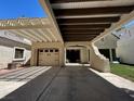 Exterior view of a charming home with a covered parking area and a two-car garage at 3142 Bel Air Dr, Las Vegas, NV 89109