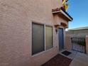 The home has a steel-door and a small, decorative, patterned entrance mat at 37 Belle Soleil Ave, Las Vegas, NV 89123