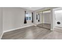 Bedroom featuring a mirrored closet and a stacked washer/dryer at 3944 Visby Ln, Las Vegas, NV 89119