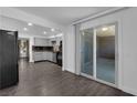Open-concept kitchen and dining area with sliding glass doors to the patio at 3944 Visby Ln, Las Vegas, NV 89119
