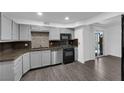 View of kitchen with stainless steel appliances and hardwood floors at 3944 Visby Ln, Las Vegas, NV 89119