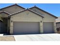 Well-kept home with a spacious three-car garage and attractive desert landscaping at 4620 Ventana Rey St, North Las Vegas, NV 89081