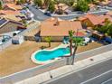 Aerial view of a single-story home featuring a backyard swimming pool and desert landscaping at 5033 Austrian Dr, Las Vegas, NV 89130
