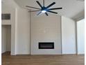 Bright living room features a modern fireplace and lots of light at 5600 Nimes Ave, Las Vegas, NV 89141