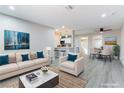 Bright living room with an open layout that flows into the dining area and adjacent kitchen at 5800 Auborn Ave, Las Vegas, NV 89108