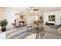 Inviting living room offers a fireplace and a stylish rug, creating a comfortable gathering space at 5809 Pebble Beach Blvd, Las Vegas, NV 89108