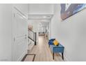 Bright hallway with high ceilings, wood floors, and a cozy blue bench, creating a welcoming atmosphere at 752 Echelon St, Las Vegas, NV 89138