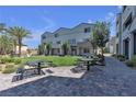 Community green space with picnic tables and beautiful walkways in front of the homes at 8436 Noir Ave, Las Vegas, NV 89129