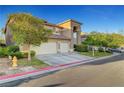 Charming two-story home features a three-car garage, desert landscaping, and inviting curb appeal at 8812 Glenistar Gate Ave, Las Vegas, NV 89143
