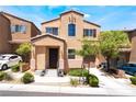 Inviting two-story home with well-maintained landscaping, walkway and private balcony at 9112 Picturesque Ave, Las Vegas, NV 89149