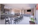 Spacious living room and kitchen with modern countertops, recessed lighting, and contemporary finishes at 1860 Old West Ave, Pahrump, NV 89048
