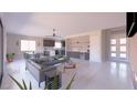 Open concept living room and kitchen featuring light colored floors and recessed lighting at 1860 Old West Ave, Pahrump, NV 89048