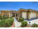 Charming single story home featuring a three-car garage, gated front yard and desert landscaping at 2016 Biloxi Pass, Henderson, NV 89052