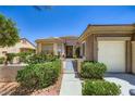 Charming single story home featuring a three-car garage, gated front yard and desert landscaping at 2016 Biloxi Pass, Henderson, NV 89052