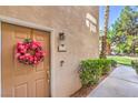 Charming front door with a decorative wreath and neat landscaping at 2050 W Warm Springs Rd # 1923, Henderson, NV 89014