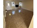 Spacious living room featuring a decorative fireplace and tile floors at 2655 Aracatuba Ave, Las Vegas, NV 89121