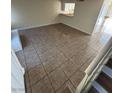Bright living room leading to a partial staircase at 2655 Aracatuba Ave, Las Vegas, NV 89121