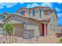 Inviting two-story home featuring a red door, neutral siding, and a well-manicured front yard at 2728 Tricase St, Henderson, NV 89044