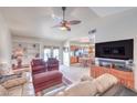 Inviting living room with cozy seating, built-in shelves, and an open floor plan at 2738 Sandalwood Ave, Henderson, NV 89074