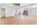 Spacious living room boasts hardwood floors, a ceiling fan, and ample natural light at 2878 El Cajon St, Las Vegas, NV 89169