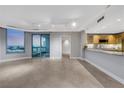 Open living space connecting kitchen with granite countertops and views to the city at 322 Karen Ave # 2501, Las Vegas, NV 89109