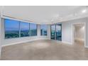 Bright, open living room with large windows showcasing a stunning cityscape view at 322 Karen Ave # 2501, Las Vegas, NV 89109