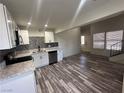 Bright open concept living and dining area with wood flooring and modern finishes at 3681 Melonies Dr # 29, Las Vegas, NV 89103