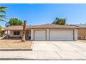 Well-maintained single-story home featuring a yard and two-car garage at 4168 Wendy Ln, Las Vegas, NV 89115