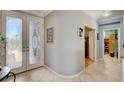 Foyer features tile flooring and a decorative glass front door at 4174 Cascada Piazza Ln, Las Vegas, NV 89135