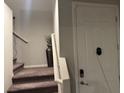 Welcoming entryway with a neutral color scheme and steps leading to the upper level at 4337 Stardusk Falls Ave, North Las Vegas, NV 89084