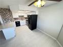 This kitchen features recessed lighting, updated appliances, and stylish backsplash at 435 Mesa Blvd # 202, Mesquite, NV 89027