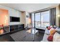 Contemporary living room with stylish furnishings and a breathtaking view of the cityscape at 4381 W Flamingo Rd # 1512, Las Vegas, NV 89103
