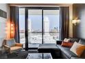 Cozy living room area with comfortable seating and a stunning view of the Palms Casino Resort at 4381 W Flamingo Rd # 1512, Las Vegas, NV 89103