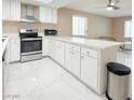 Modern kitchen featuring stainless steel appliances, white cabinets, and a long island at 4420 Rich Dr # B, Las Vegas, NV 89102