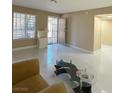 Inviting living room with neutral walls, ample natural light, and modern tile floors at 4420 Rich Dr # B, Las Vegas, NV 89102