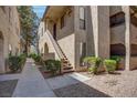 Attractive condo exterior featuring well-maintained landscaping, stucco facade, and inviting walkway at 4742 Obannon Dr # A, Las Vegas, NV 89102