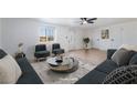 Inviting living room with ample seating and natural light perfect for relaxing and entertaining guests at 5069 Hallet Dr, Las Vegas, NV 89122