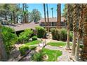 Stunning front yard with manicured landscaping, mature trees, and inviting bridge feature at 5260 N Jones Blvd, Las Vegas, NV 89130