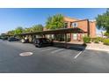 Assigned covered parking spot that protects vehicles from the elements with building in background at 555 E Silverado Ranch Blvd # 2129, Las Vegas, NV 89183