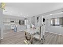 Open-concept layout featuring dining, kitchen, and living areas at 5923 Halehaven Dr, Las Vegas, NV 89110
