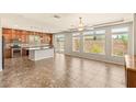 Open-concept room features tile flooring and seamless access to the gourmet kitchen at 6014 Belvedere Canyon Ave, Las Vegas, NV 89139
