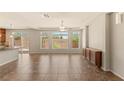 Spacious living room filled with natural light and tile flooring at 6014 Belvedere Canyon Ave, Las Vegas, NV 89139