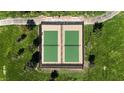 Overhead view of the community tennis courts surrounded by lush greenery and accessible walking paths at 86 Sonata Dawn Ave, Henderson, NV 89011
